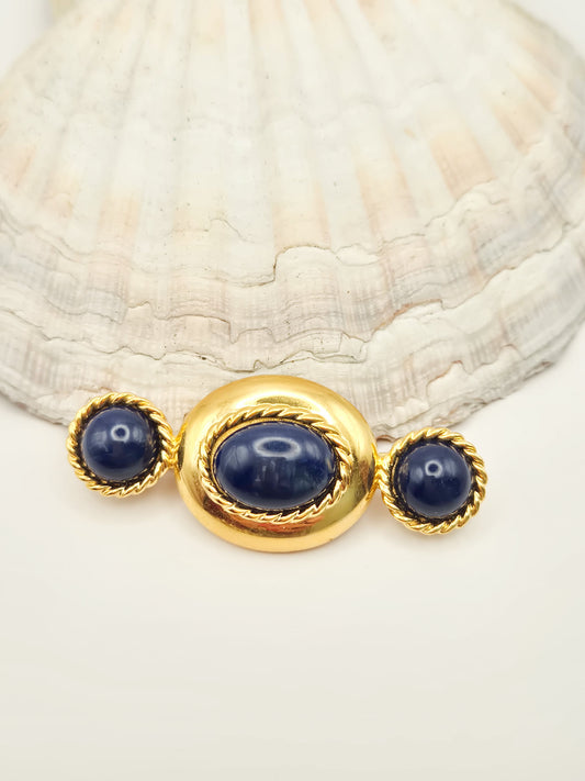 Vintažinė MONET sagė su mėlynais kabošonais